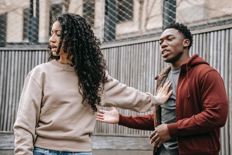 A woman with curly hair having a disagreement