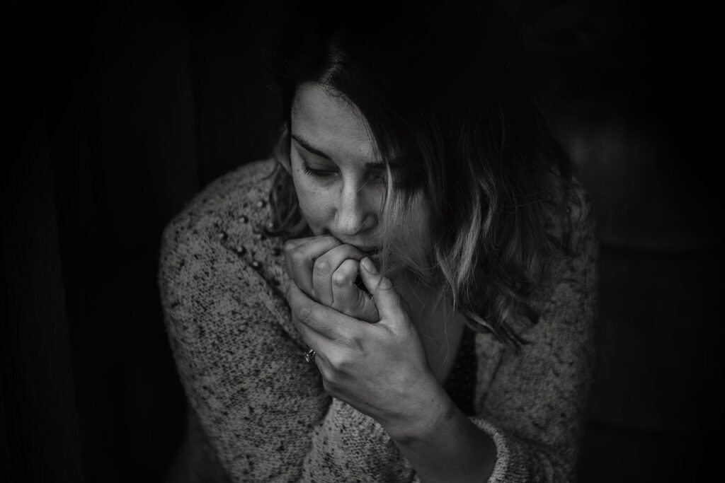 Freedom Counseling Center with a lady biting her nails