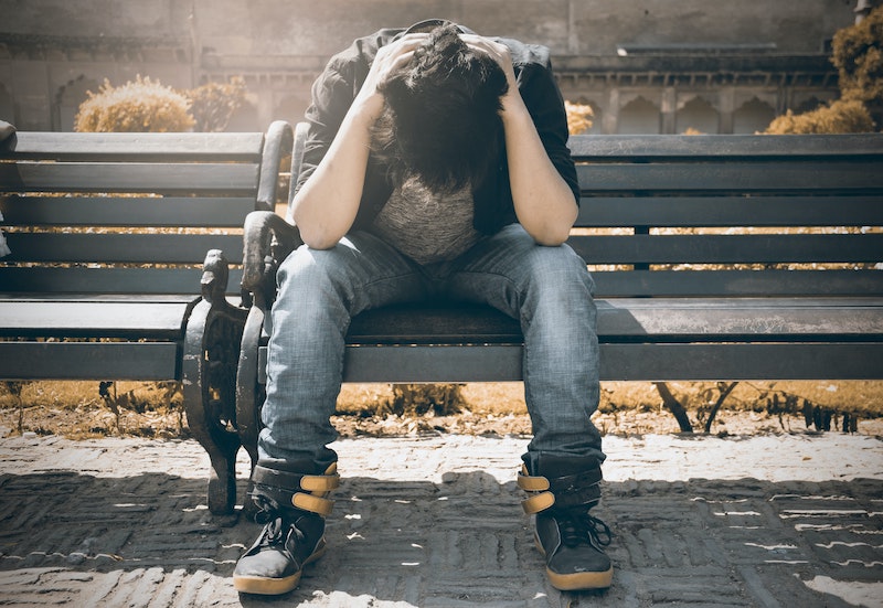 A person wearing a black color shirt in stress