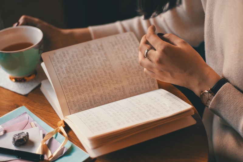 A woman reading the notebook